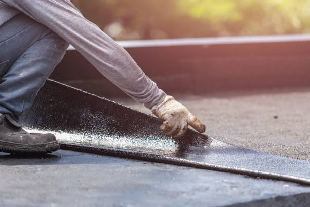 Professional Basement Waterproofing technician working in Lumberton, NC